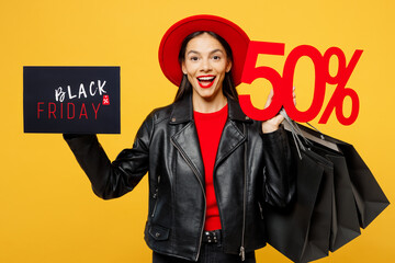 Young woman wear casual clothes red hat hold shopping package bags cover face card sign with Black...