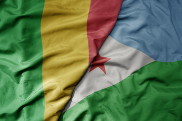 Obraz premium big waving national colorful flag of mali and national flag of djibouti .