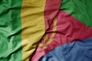 big waving national colorful flag of mali and national flag of eritrea .