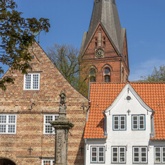 Buildings of the Nordermarkt with Neptune Fountain and St. Mary's Church in Flensburg, Schleswig-Holstein, Germany