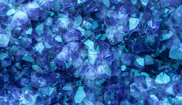 Blue Crystal Mineral Stone. Gems. Mineral crystals in the natural environment. Texture of precious and semiprecious stones. Seamless background with copy space colored shiny surface of precious stones