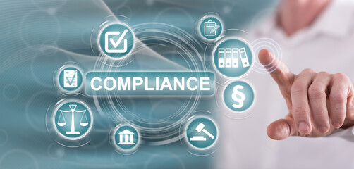 Man touching a compliance concept