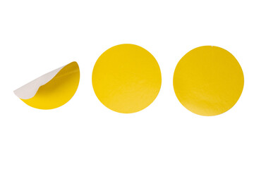 Round yellow stickers, blank tags labels isolated on a white background.