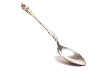 Old silver teaspoon with handle pattern isolated on white background
