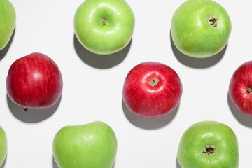 Ripe green and red apples on white background, flat lay