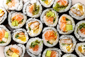 Top view of various sushi rolls.