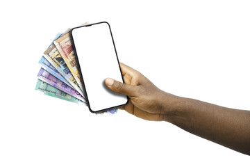 Black hand holding mobile phone with blank screen and Jamaican dollar notes