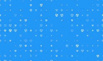 Seamless background pattern of evenly spaced white radiation symbols of different sizes and opacity. Vector illustration on blue background with stars