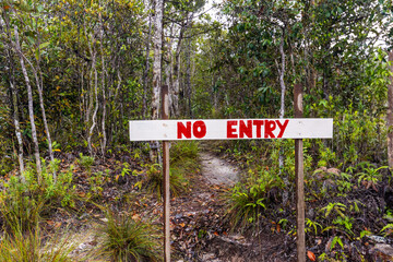 Closed trail in the national park, a board with the inscription 