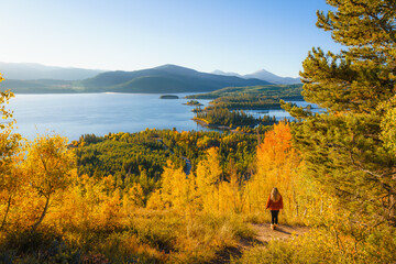 Girl looks out across autumn Colorado landscape