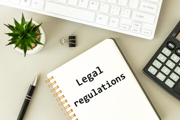 Legal regulations, text in a notebook, Office desk, accounting, changes in law,  taxes and finances