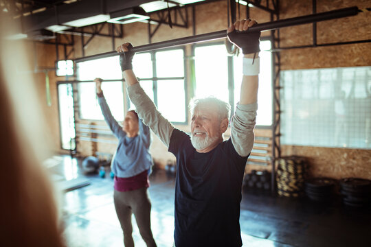 Senior individuals actively engaging in gym exercises