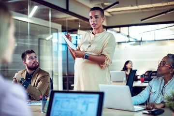 Diverse team collaboratively discussing in a contemporary office setting