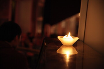 candle on a dusty piano