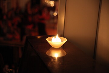 candle on a dusty piano