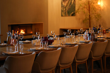 The festive table is covered with dishes, napkins, and glasses.