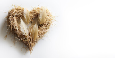 Handmade heart made of straw and dry plants on a white background. Valentine's day idea