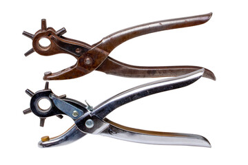 Tailor accessories. Close-up of a antique adjustable steel punch pliers and a modern hole punch tool isolated. Clipping path. Tools from tailor, saddler or cobbler. - obrazy, fototapety, plakaty