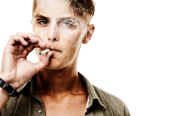 Man, portrait and smoking a cigarette in studio for nicotine, enjoyment or habit on white background. Person, face and smoker with tobacco for smoke, peer pressure or confidence with mock up space