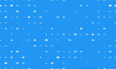Seamless background pattern of evenly spaced white tractor icons of different sizes and opacity. Vector illustration on blue background with stars