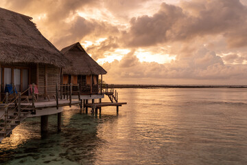 French Polynesia Tikehau atoll. Beautiful sunrise over the coral reef lagoon seen from overwater...