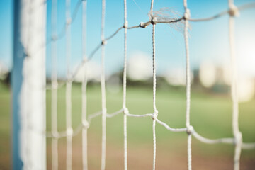 Empty, sports and goal post on soccer field for fitness training, exercise or workout outdoors. Football club, grass pitch background or closeup of blur net of game in competition or match contest