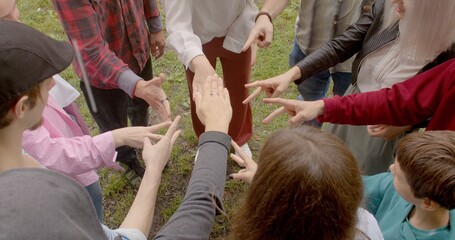 Fototapeta premium Group people plays rock paper scissors impartial method making decisions. Fair Conflict Resolution. Playing game random determine winner. Social gatherings background 