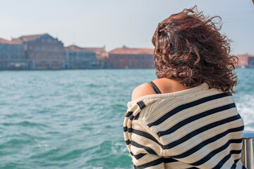 Fototapeta na wymiar Latina woman on vacation in Venice city in Italy. Holidays and vacation concept