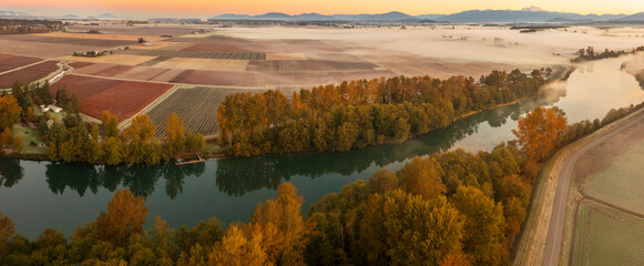 Aerial view of the Skagit River Valley during a beautiful and dramatic autumnal sunrise. The Skagit...