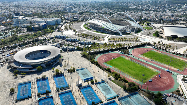Aerial drone panoramic view of sports facilities of OAKA and Olympic Stadium designed by Santiago Calatrava, Klogreza, Attica, Greece