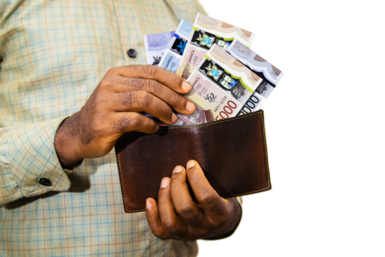 Black person Holding brown wallet
With Jamaican dollar notes, hand removing money out of wallet isolated on white background removing money from wallet