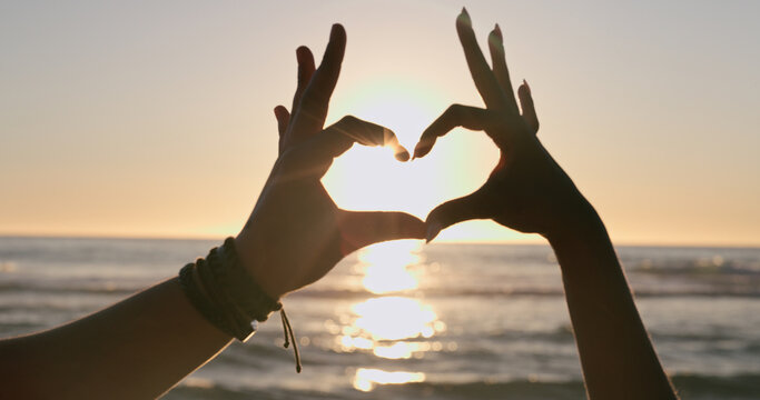 Love, Hands And Heart On Beach With Sunset, Water Background And Horizon For Vacation, Travel Or Adventure. People, Man And Woman By Ocean Or Sea With Emoji For Romance, Care And Relationship On Trip