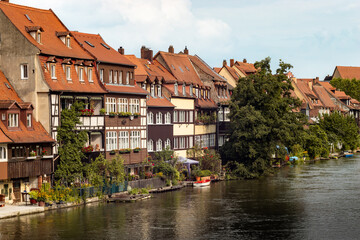 Fototapeta na wymiar Buildings of Little Venice (Klein Venedig) in Bamberg, Germany. The half timbered houses are a tourist attraction. Old town architecture next to the Regnitz river.