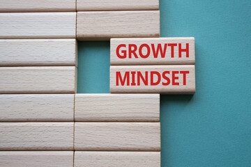 Growth Mindset symbol. Concept word Growth Mindset on wooden blocks. Beautiful grey green background. Business and Growth Mindset concept. Copy space