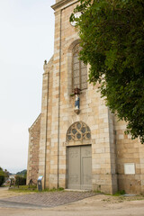 Fototapeta na wymiar Entrance of the Church of St Samson Notre Dame de Beauport in Paimpol, Cotes-d'Armor, Brittany, France. Vertical shot.