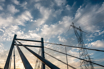 modern metal cable bridge imeni Kaczorowskiego on blue sky background, Lublin