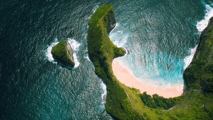 Mountain rainforest by the ocean with golden sandy beach Kelingking. Clear sea waves wash Nusa...