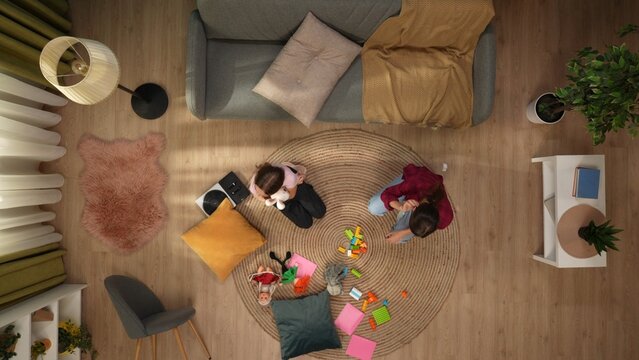 In The Top Frame, A Woman And A Child, The Family Sit On The Floor Of The Room, Next To The Sofa. Around Are Toys, They Play, They Have Fun. Portray Family Leisure, Entertainment, Love