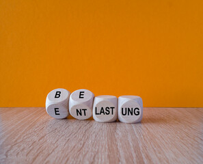 Turned a cube and changes the German expression 'belastung' (strain) to 'entlastung' (relief)....