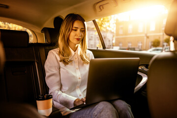 Young business woman in car