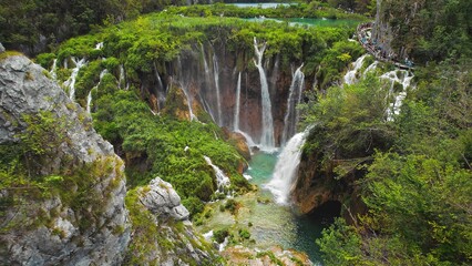 Plitvice lakes National park with waterfalls in Croatia. Mountain landscape, stream flow with azure clear water. Summer travel destination.