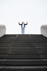 Business woman, stairs and celebration for success, goal or winning in finance career, investment...