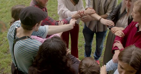 People in circle joined hands. People during group somatic therapy to self-discovery, emotional healing, personal growth, connection between body and mind. Ukranian refuges ptsd trauma psychotherapy