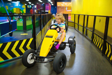 Kids on carting track. Go-kart fun for children.