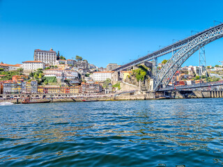 Fototapeta na wymiar View of Ribeira, the Dom Luis bridge and the Douro river in Porto, Portugal