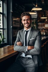 A youthful and attractive male entrepreneur embracing positivity and seeking new opportunities.