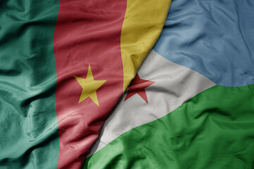 Obraz premium big waving national colorful flag of cameroon and national flag of djibouti .