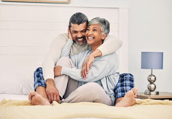Hug, happy or old couple in bed to relax, enjoy romance or morning time together at home in retirement. Embrace, senior woman or funny elderly man laughing or bonding with love, support or smile - obrazy, fototapety, plakaty