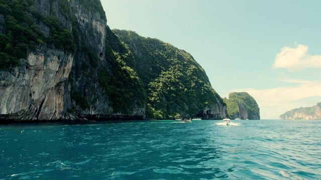 Beautiful view famous beach blue lagoon with limestone rocks in kho phi phi. Vacation holiday tropical travel. Asia travel.