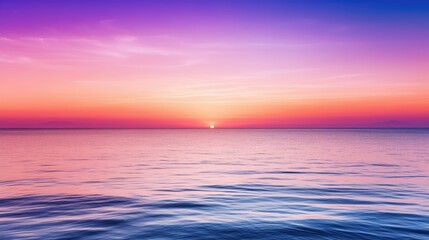 Tranquil sunset over the ocean, with a serene color gradient of purple, blue, orange, and pink. The...
